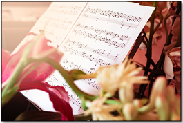 Flowers lying on top of sheet music